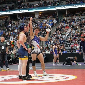 Luke Graver (165), 6th place - ref holding Luke's hand over his head after he won his match